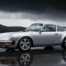 Porsche 911 Carrera 4 transmission intégrale sur route de montagne humide