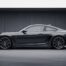 Porsche 911 Carrera T grise garée dans un garage épuré