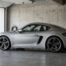 Porsche Cayman de base occasion en trois quarts, dans un garage